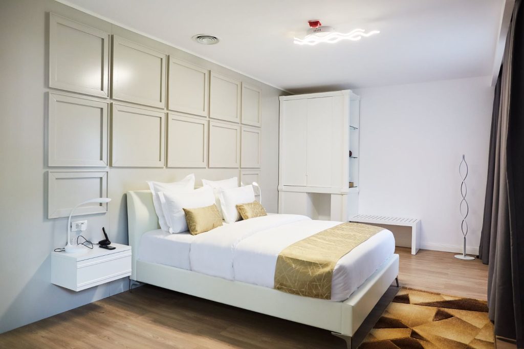 Bedroom in the Two Bedroom Suite with white panelled walls